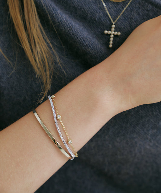 옐로우 골드 | Lab Grown Diamond Bezel Station Bracelet, 5 Stones, worn, stacked with tennis bracelet and bangle