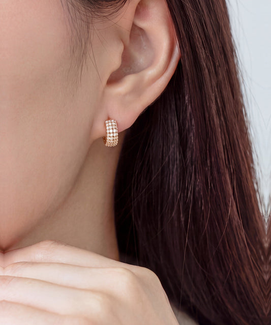 Pavé Lab Grown Diamond Ribbed Huggie Hoop Earrings in Rose Gold worn, hand at the jaw