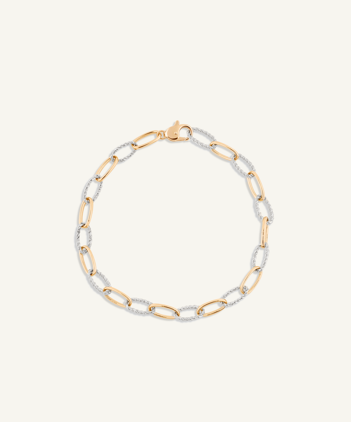 옐로우 골드 & 화이트 골드 | shot 1 | Two-tone twist chain bracelet, yellow gold with white gold twisted links, on a white background